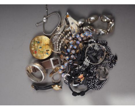 A selection of costume and other jewellery, including a hinged silver bangle, a silver bracelet in the Mulberry style, a powd