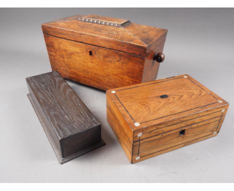 A 19th century rosewood sarcophagus&nbsp;tea caddy with ring handles, on bun feet, 14 1/4" wide, a similar jewellery box with