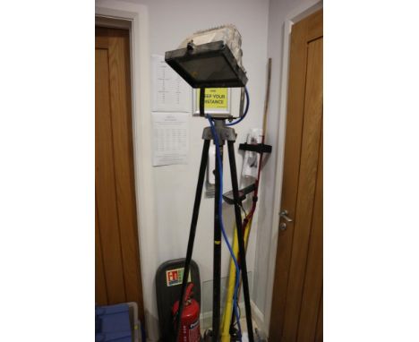 A floor standing flood light, on tripod support 