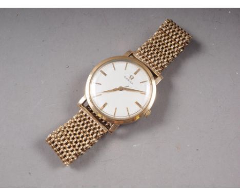 A gentleman's Omega 9ct gold cased manual wind wristwatch with silvered dial and baton numerals, serial no 17466566, on 9ct g