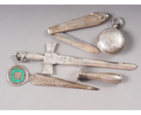 A silver letter opener, formed as a Celtic style sword, 5 3/4" long overall, a silver sovereign case with engraved decoration