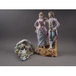 A contemporary German porcelain wall bracket with relief flower and cherub decoration, 7 3/4"
