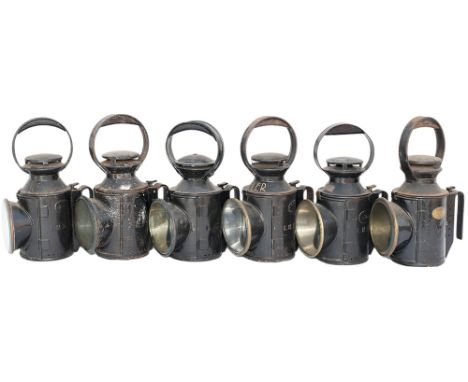 LMS handlamps x6, all complete with reservoirs, burners and glasses. One is brass plated A.E.WHEELER WESTHOUSES, another plat
