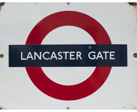London Transport enamel roundel sign LANCASTER GATE. Measures 28in x 22in and is in good condition.