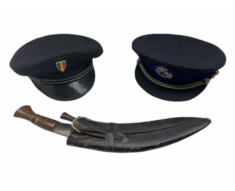 Kukri in scabbard with one skinning knife and 1980s French and Belgian police peaked caps