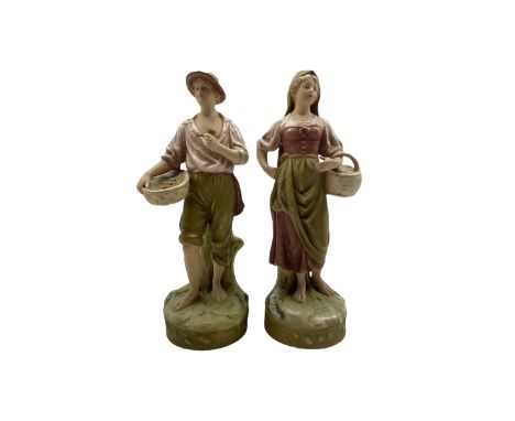 Pair of Royal Dux standing figures of male and female fish sellers, model numbers 2291 and 2292 H28cm