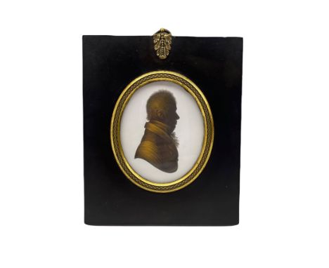 John Miers (1758-1821) Oval silhouette portrait of a gentleman with trade label to the reverse, ebonised frame with gilt meta