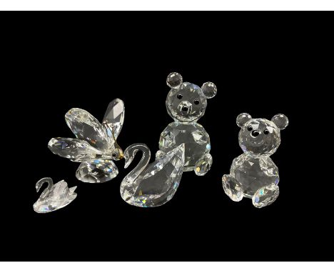 Group of Swarovski Crystal animal figures to include a Butterfly, SCS Swan, another swan and two teddy bears, all with origin