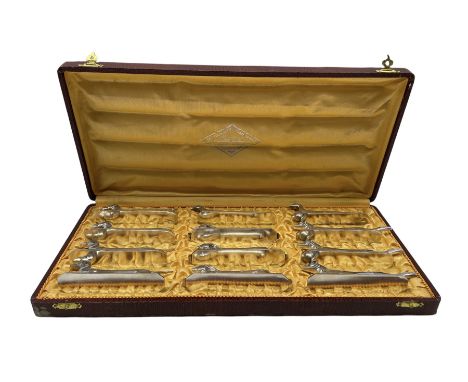 'Les Animaux Modernes' a set of twelve early 20th century French silvered-bronze knife rests cast as three Foxes, three Hares
