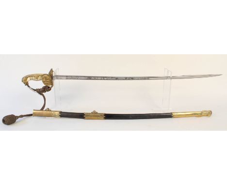 An Imperial German Naval Officers sword by W.K. &amp; G, having an etched pipe-back blade and brass mounted leather scabbard