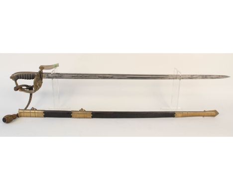 A British GV Naval Officers sword with brass mounted leather scabbard and sword knot