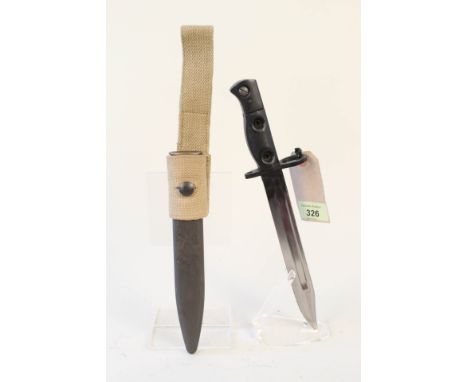 A British 1950 model sterling L2 S.M.G. bayonet with scabbard and webbing frog