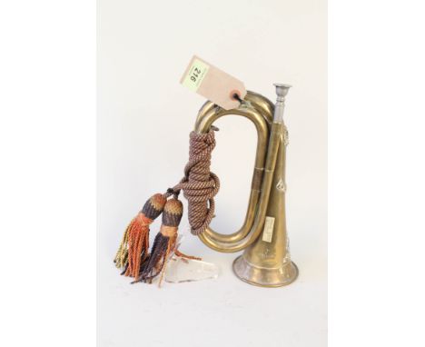 A brass bugle badged to The West Riding Regt, also marked 40070 Bugler E.Dawson and broad arrow W.Riding