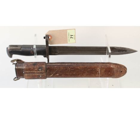 A U.S.A. WWII era M.I. bayonet, in earlier 1909 dated leather scabbard