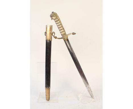 A Victorian Naval dirk with etched blade including Victorian crown, complete with brass mounted leather scabbard