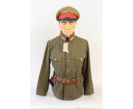 A representation of a Japanese WWII Army Officer in 'parade' tunic, cap and belt, included with this lot is the bespoke manne
