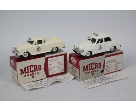 Micro Models - 2 x boxed limited edition Holden Police cars in 1:43 scale, an FX sedan in Victoria Police livery # MM012 and 