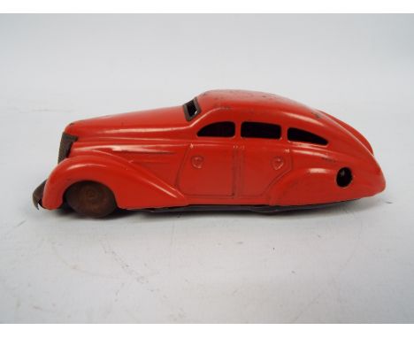Schuco - A clockwork tinplate Schuco 1010 model car marked made in US-Zone Germany. The car shows some signs of age and use a