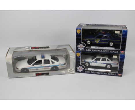 UT Models - Motor Max - 3 x boxed American Cop cars, a 1:18 scale Chevrolet Impala in Chicago PD livery # UT0597, and two 1:2