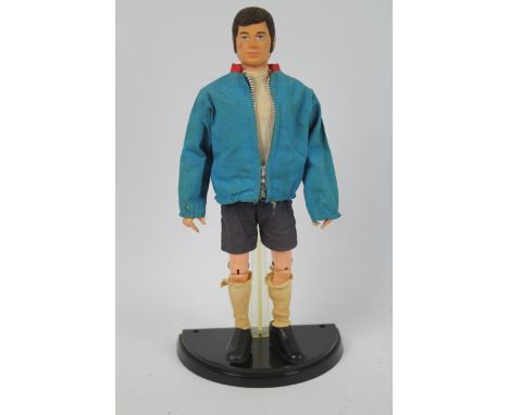 Palitoy - Action Man - A vintage unboxed Palitoy Action Man Footballer figure with sideburns. The black flock haired, hard ha