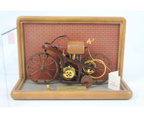 Franklin Mint - A Franklin Mint 1/8 scale 1885 Daimler Single Track Motorcycle. The model appears to be in Excellent conditio