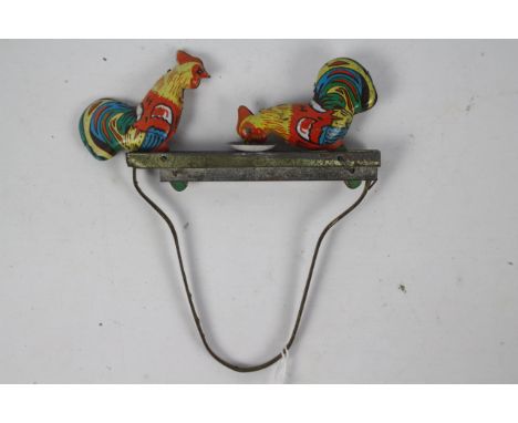 Vintage tin plate mechanical pecking rooster toy - A vintage tin plate toy. Squeeze and release the handle, the cockerels/roo