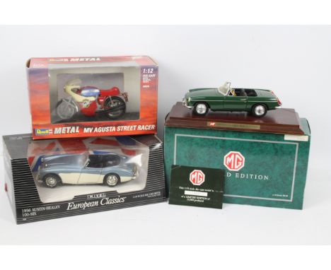 Corgi -Three boxed diecast vehicles in various scales. Lot consists of a Limited Edition Corgi 1:18 scale MGB with plinth and