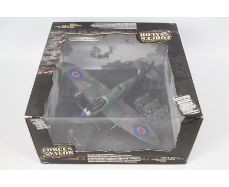 Forces Of Valor - A boxed 1:32 scale British Spitfire MK IX No.132 Wing, The Netherlands 1945 # 80224. The model appears Mint