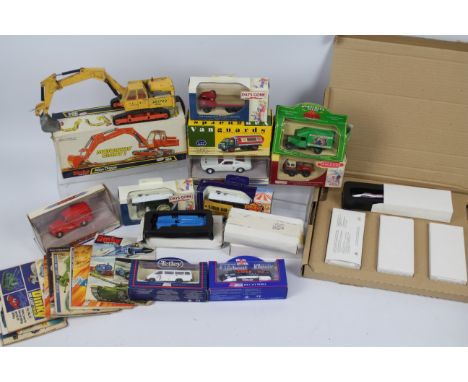 Dinky Toys - Lledo. A selection of 18 boxed die cast models to include: A Dinky Toys Atlas Digger #9884 item is in Good Playw