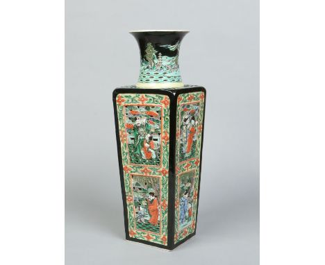 A 19th century Chinese famille noir square high shouldered reticulated vase. The waisted collar is decorated with a continuin