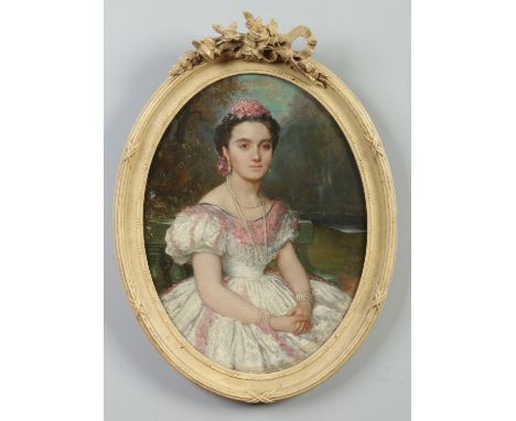 A 19th century Continental school oval oil on canvas in carved and painted frame. Portrait of a seated maiden, 39cm x 29cm.  