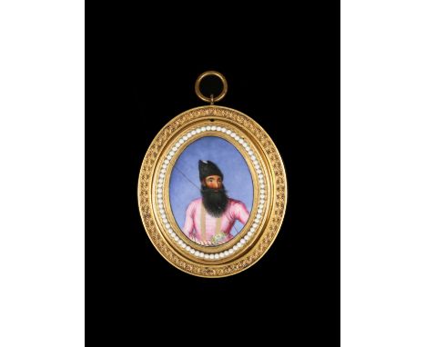 An early 19th century Anglo Indian portrait miniature on porcelain with jewelled moulding and in gilt metal mount. Portrait o