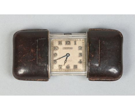 An Art Deco silver and leather mounted Movado sliding watch. With square dial and having applied Arabic numeral markers. Sign