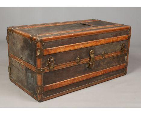 A wooden and brass bound steamer wardrobe trunk. Label for R. Millot, 1m 12cm.