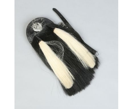 A leather and sable two tassel sporran with crest for the Cameron Highlanders.  Makers J. G Stevenson 1939 with broad arrow. 
