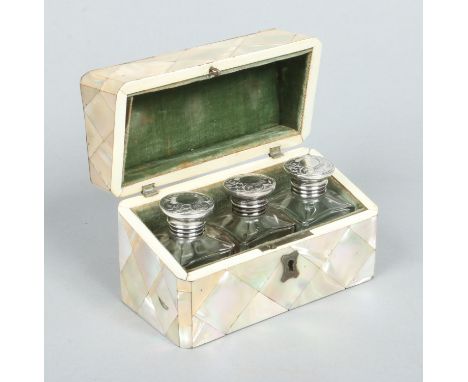 A Victorian parquetry inlaid mother of pearl casket containing three glass scent bottles each with engraved white metal tops,