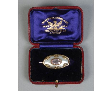 A cased yellow metal, mother of pearl and amethyst brooch of ovoid form, 28mm. Condition Report. To be used as a guide only. 