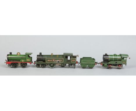 A collection of Hornby O gauge tinplate model railway. Including three clockwork engines, 4-4-4 Great Western locomotive 2243