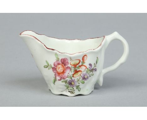 A Lowestoft low Chelsea ewer painted in coloured enamels with a small flower bouquet and two sprays under a brown edged rim c