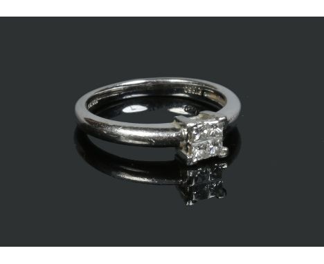 A platinum and diamond four stone ring, size K 1/2. Condition Report. To be used as a guide only. Good condition. 