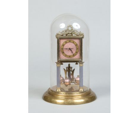 A German brass torsion clock under glass dome. With square dial having guilloche enamel ground and with gilt chapter ring. Ra