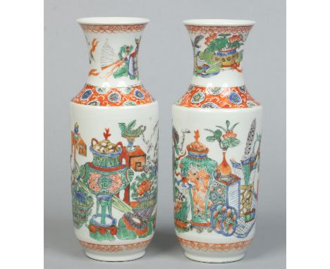 A pair of 19th century Chinese famille vert mantel vases. Painted with archaic vases, precious objects and flowers, 25.25cm. 