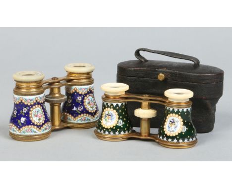 Two pairs of early 20th century French lacquered brass opera glasses with enamelled grips, one pair in a leather case. Each w