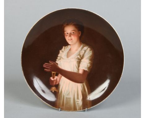 A Vienna plate painted with the portrait of a young girl holding a candlestick. Painted shield mark and titled Good night, 24