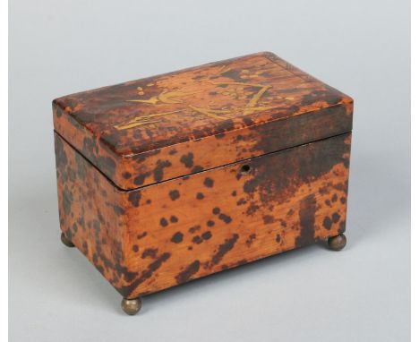 A 19th century simulated tortoiseshell and lacquered two section tea caddy with sliding compartment covers. Decorated in the 