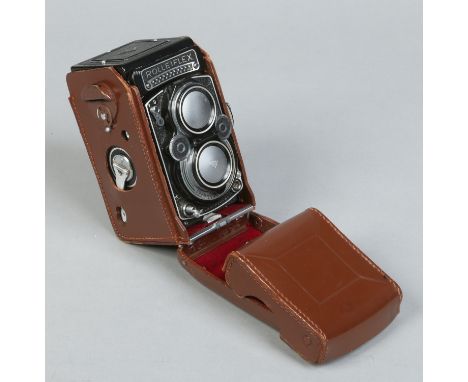 A rare cased Rolleiflex type 1 TLR camera, model K4E having built in light meter. With 3,5f 75mm lens, seriel No. 2219440. Co