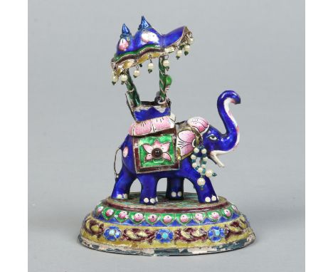 An early 20th century Indian enamelled silver model of an elephant with a howdah having two passengers and raised on a steppe