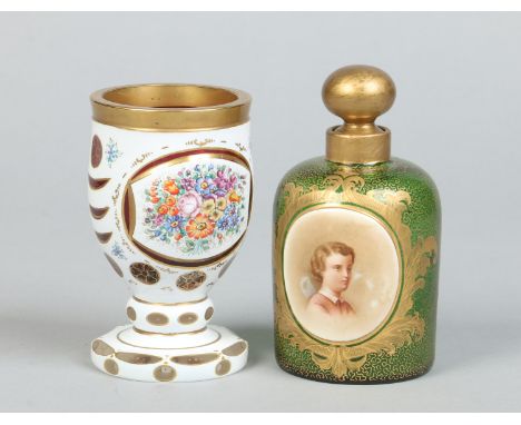 A 19th century Bohemian emerald glass scent bottle, gilded and painted with a portrait along with a similar cranberry glass g