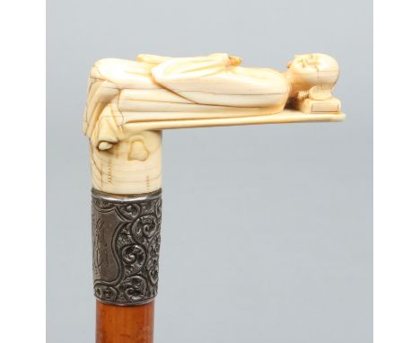 A Victorian malacca walking stick with silver collar and Cantonese carved ivory handle formed as a reclining figure. Assayed 