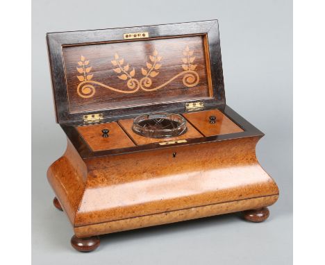 A large Victorian bombe shaped bur walnut tea caddy. Banded in rosewood and raised on squat bun feet. With marquetry inlaid i